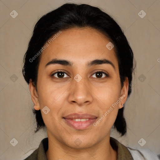 Joyful latino young-adult female with medium  brown hair and brown eyes