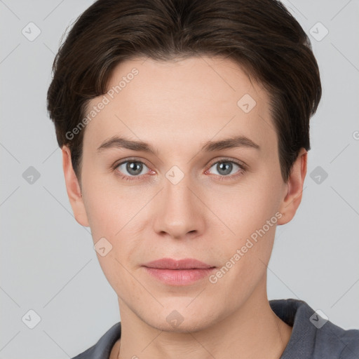 Joyful white young-adult female with short  brown hair and grey eyes