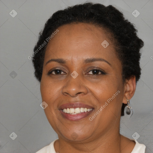 Joyful black adult female with short  brown hair and brown eyes