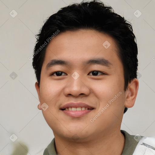 Joyful asian young-adult male with short  black hair and brown eyes