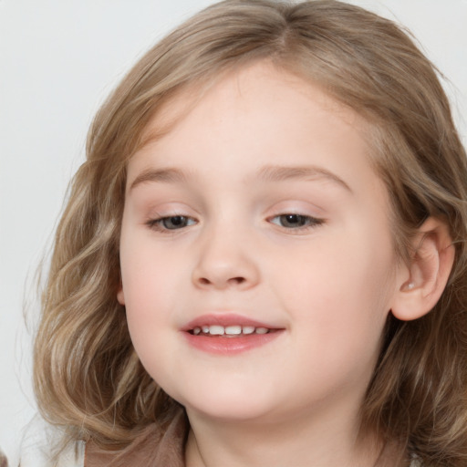 Joyful white child female with medium  brown hair and brown eyes