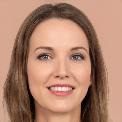 Joyful white young-adult female with long  brown hair and brown eyes