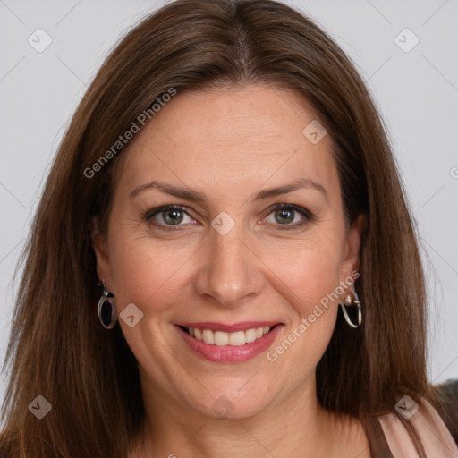 Joyful white adult female with long  brown hair and brown eyes