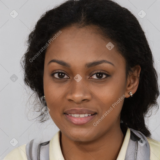 Joyful black young-adult female with long  brown hair and brown eyes