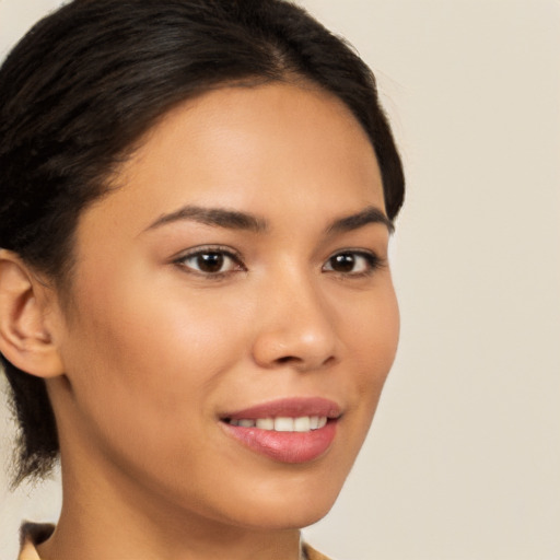 Joyful latino young-adult female with medium  brown hair and brown eyes