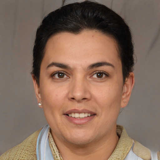 Joyful white adult female with short  brown hair and brown eyes