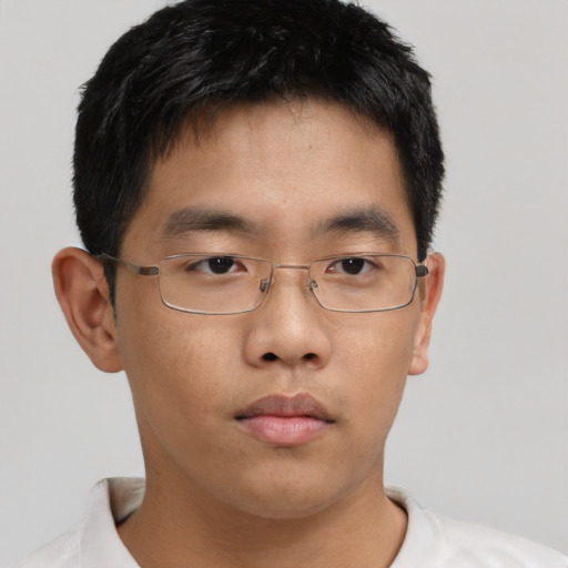 Neutral asian young-adult male with short  brown hair and brown eyes
