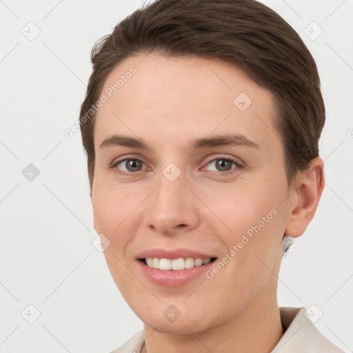 Joyful white young-adult female with short  brown hair and brown eyes