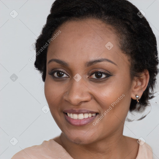 Joyful black young-adult female with medium  brown hair and brown eyes