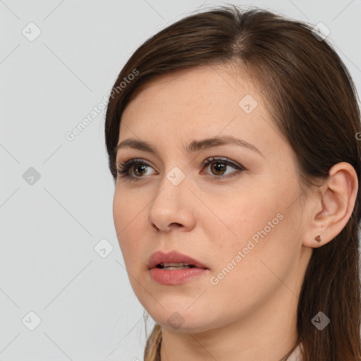 Neutral white young-adult female with long  brown hair and brown eyes