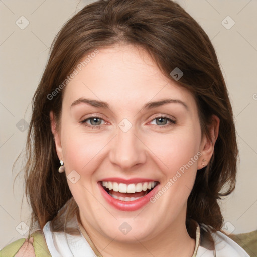 Joyful white young-adult female with medium  brown hair and green eyes