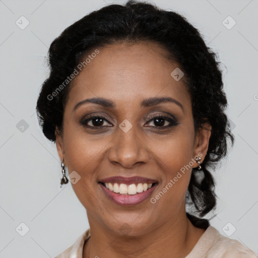 Joyful latino adult female with medium  brown hair and brown eyes