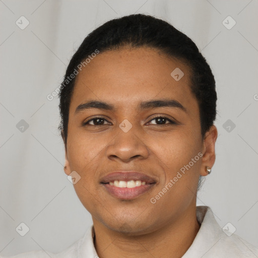 Joyful latino young-adult female with short  black hair and brown eyes