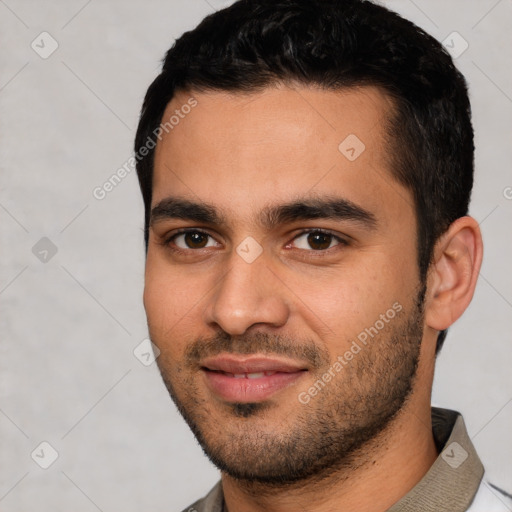 Joyful white young-adult male with short  black hair and brown eyes