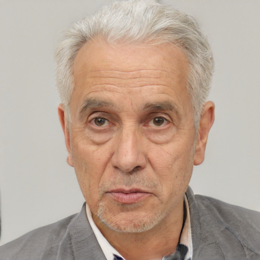 Neutral white middle-aged male with short  gray hair and brown eyes