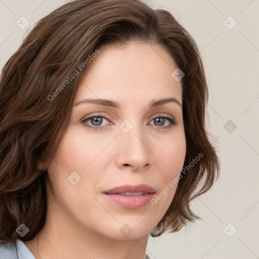 Joyful white young-adult female with medium  brown hair and green eyes