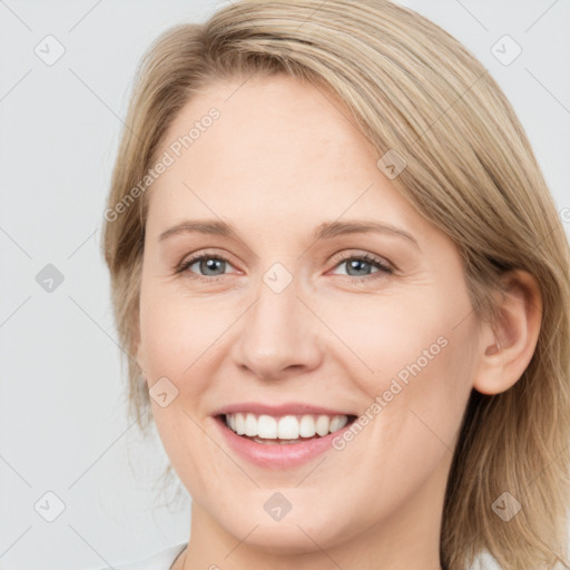 Joyful white young-adult female with medium  brown hair and blue eyes