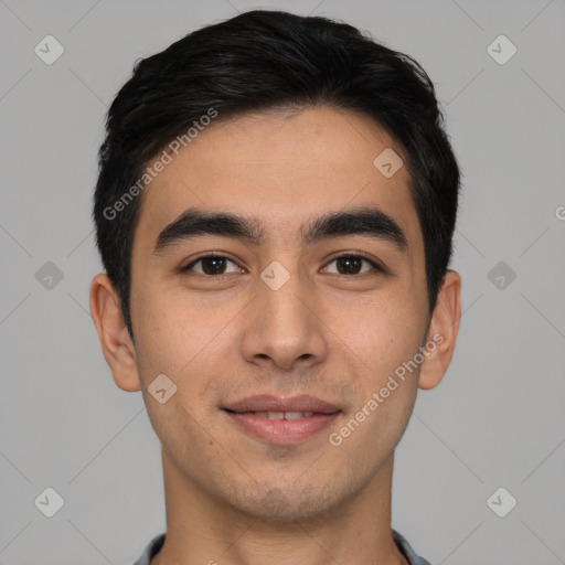 Joyful white young-adult male with short  black hair and brown eyes