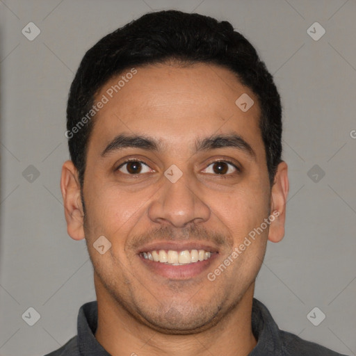 Joyful latino young-adult male with short  black hair and brown eyes