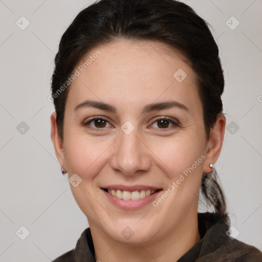 Joyful white adult female with short  brown hair and brown eyes