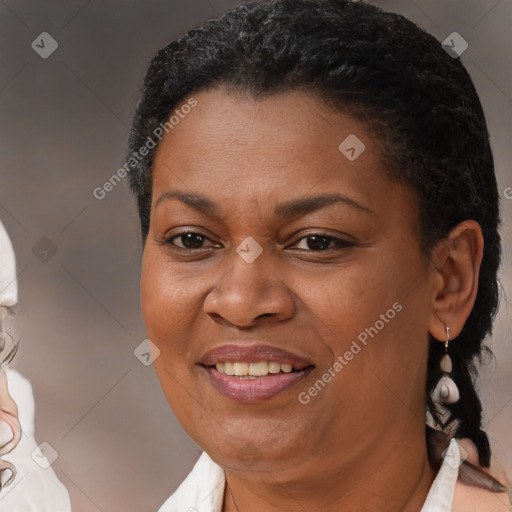 Joyful black adult female with short  brown hair and brown eyes