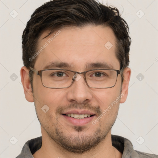 Joyful white adult male with short  brown hair and grey eyes