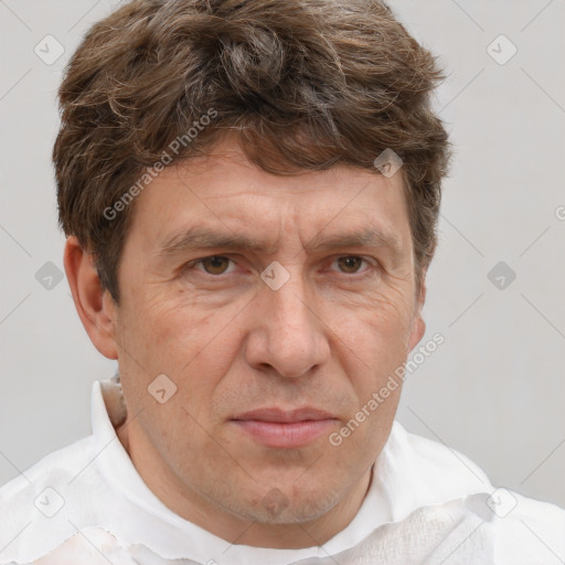 Joyful white middle-aged male with short  brown hair and brown eyes