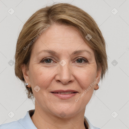 Joyful white adult female with medium  brown hair and grey eyes