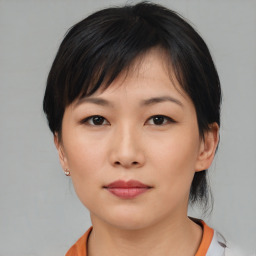 Neutral asian young-adult female with medium  brown hair and brown eyes