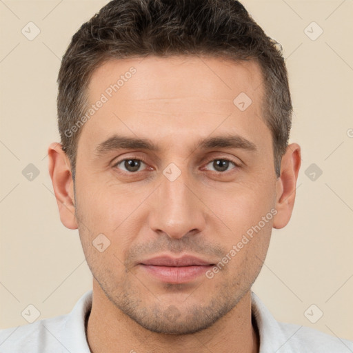 Joyful white young-adult male with short  brown hair and brown eyes