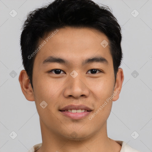 Joyful asian young-adult male with short  black hair and brown eyes