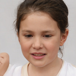 Joyful white child female with short  brown hair and brown eyes