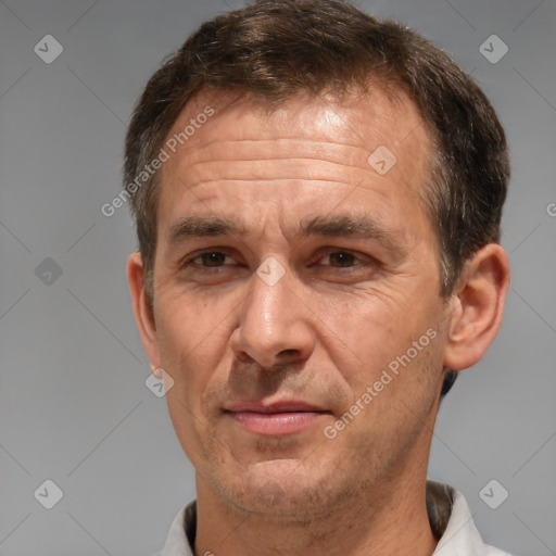 Joyful white middle-aged male with short  brown hair and brown eyes