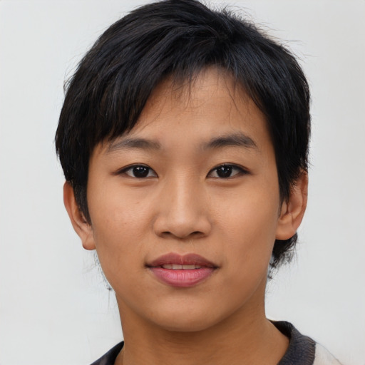 Joyful asian young-adult female with short  black hair and brown eyes