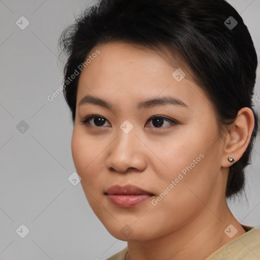 Joyful asian young-adult female with medium  brown hair and brown eyes