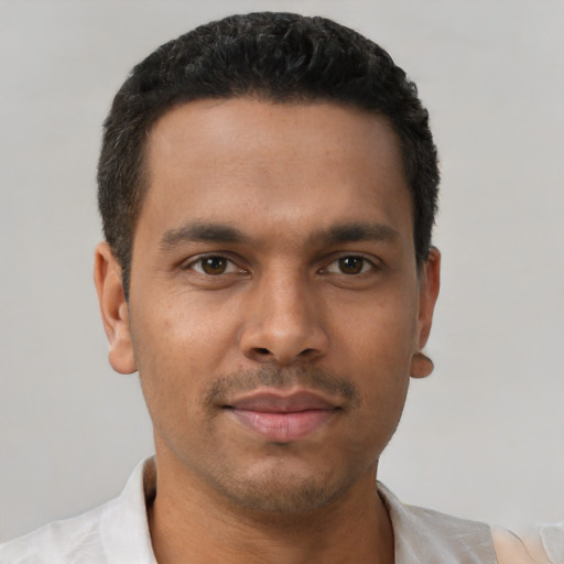 Neutral latino young-adult male with short  black hair and brown eyes