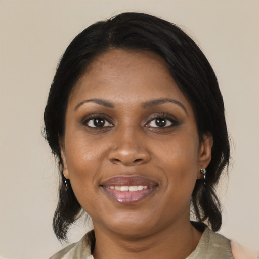 Joyful black young-adult female with medium  black hair and brown eyes
