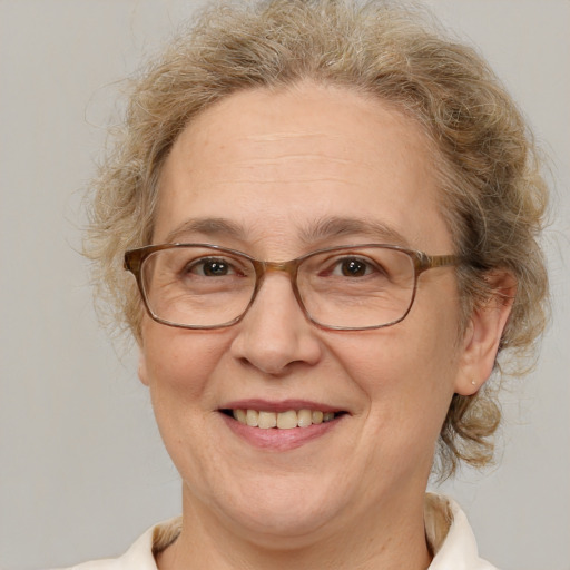 Joyful white middle-aged female with medium  brown hair and brown eyes