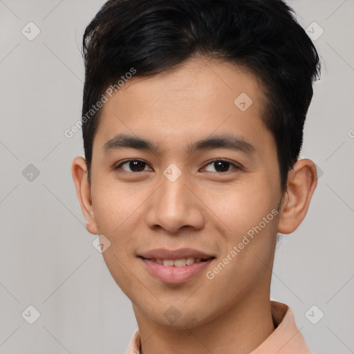 Joyful asian young-adult male with short  black hair and brown eyes