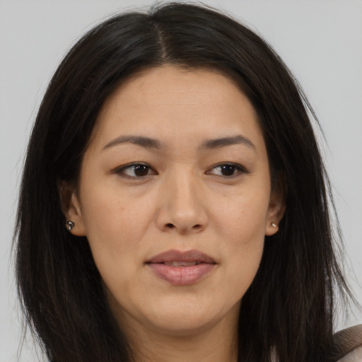 Joyful asian young-adult female with long  brown hair and brown eyes