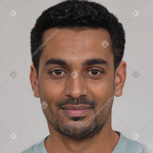 Joyful black young-adult male with short  black hair and brown eyes