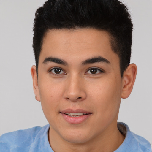 Joyful asian young-adult male with short  brown hair and brown eyes