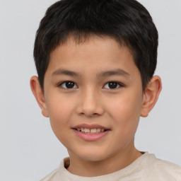 Joyful white child male with short  brown hair and brown eyes