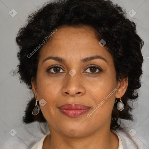 Joyful latino adult female with medium  brown hair and brown eyes