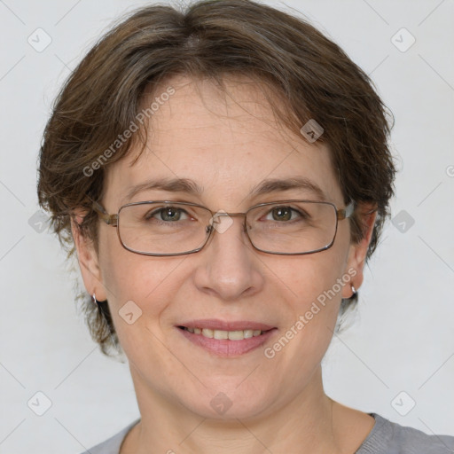 Joyful white adult female with short  brown hair and grey eyes