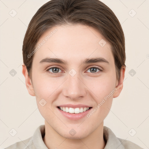 Joyful white young-adult female with short  brown hair and grey eyes