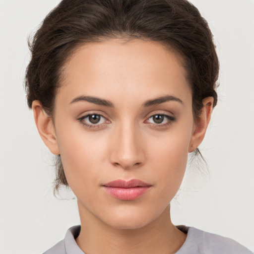 Neutral white young-adult female with medium  brown hair and brown eyes