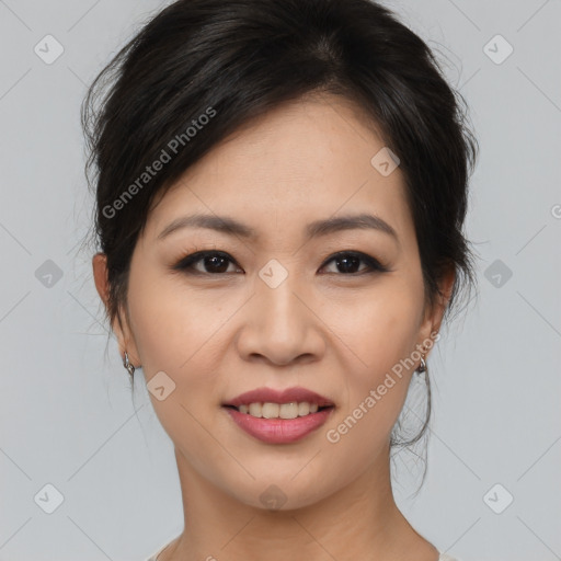 Joyful asian young-adult female with medium  brown hair and brown eyes