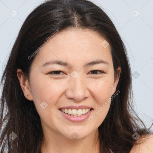 Joyful white young-adult female with long  brown hair and brown eyes