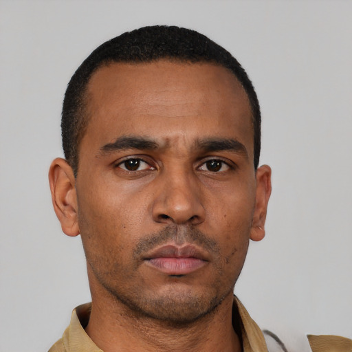 Neutral latino young-adult male with short  brown hair and brown eyes